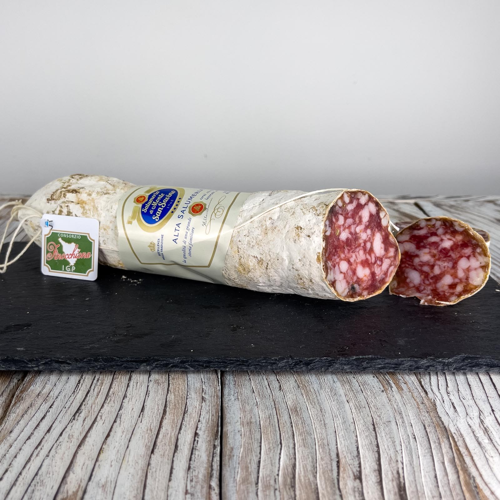 PGI Finocchiona is one of the most famous Tuscan cured meats. It is produced with pork of excellent quality, minced and kneaded, to which wild fennel seeds are added, which give it the characteristic fresh and at the same time intense aroma. This version of PGI Finocchiona has a net weight of about 500 g and is packaged whole in natural casing.