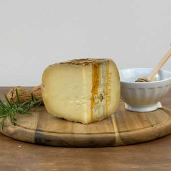 Pecorino Cheese Aged Under Straw And Hay.