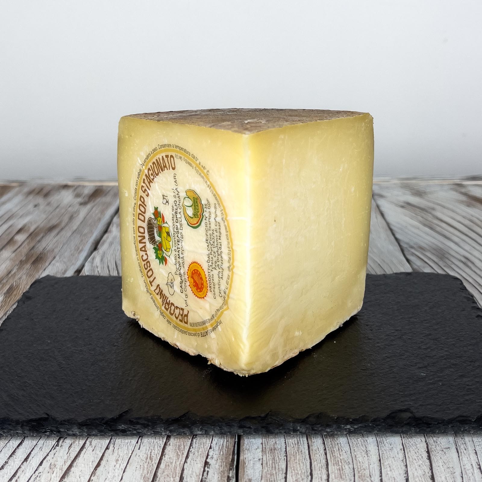 Aged Tuscan Pecorino Cheese PDO is a traditional cheese, characterized by a hard paste obtained from pasteurized sheep's milk, with the addition of rennet and salt. Aged Tuscan Pecorino Cheese PDO has a minimum maturation of 120 days and is suitable for enriching traditional Italian dishes.